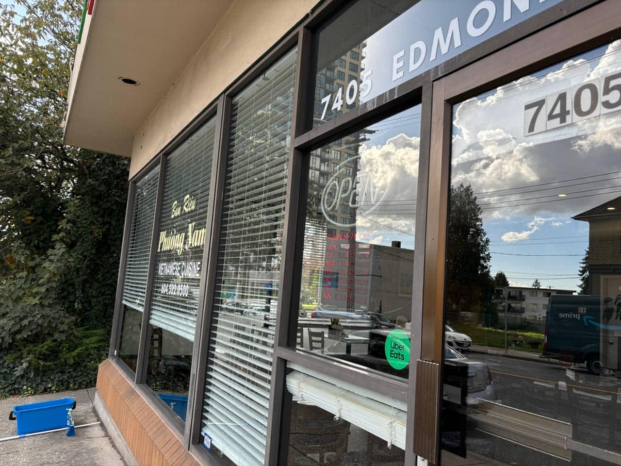 Reflective commercial glass beside a storefront entrance
